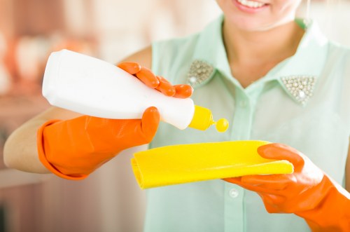 Professional cleaner in Brent preparing a property for cleaning